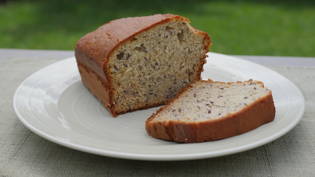 Two slices of banana bread on a white plate